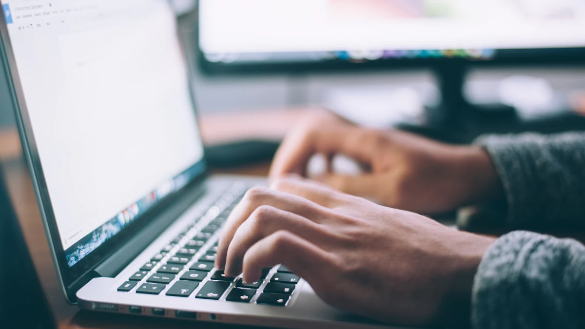 Business professional using a laptop for office productivity work
